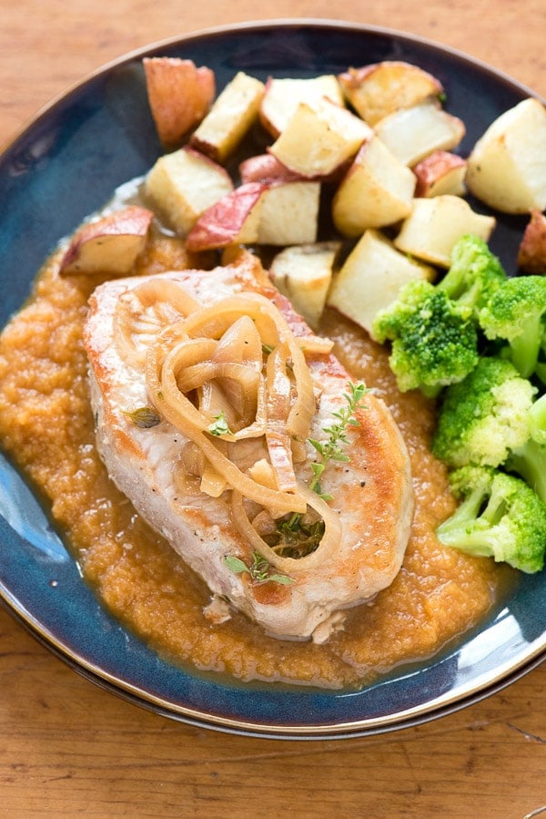Pumpkin Spice Apple Sauce with Pumpkin-Cider Braised Pork Chops on plate with sides