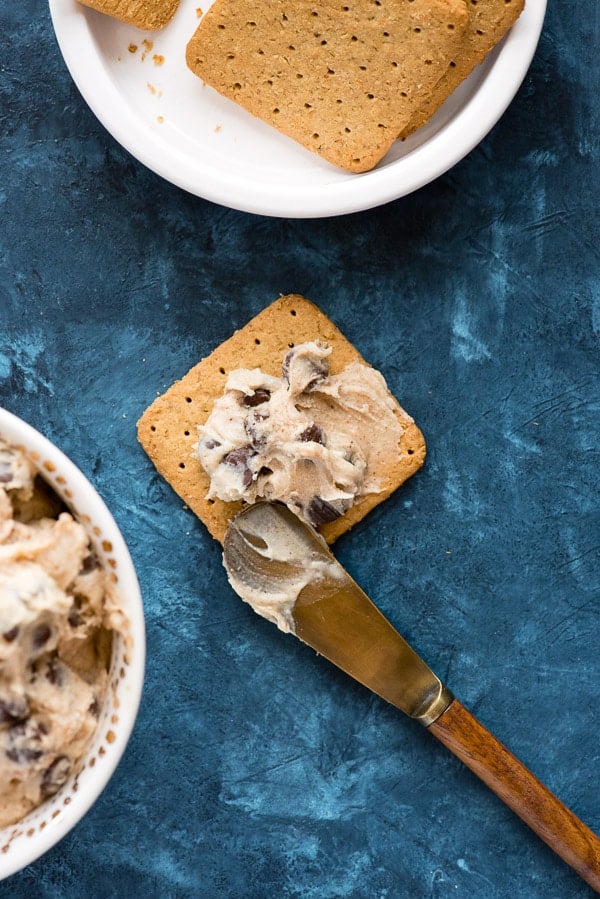 Pumpkin Spice Cookie Dough dip on a gluten-free graham cracker