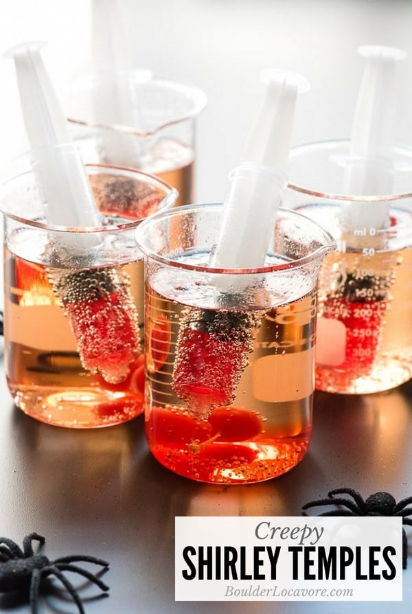 Creepy Shirley Temples. Turn a classic childhood mocktail into a cringy Halloween sipper sure to delight everyone! Some simple props and the ordinary becomes extraordinary! #halloween #halloweenparty #easyrecipe #mocktail #sipper #drinks #shirleytemple