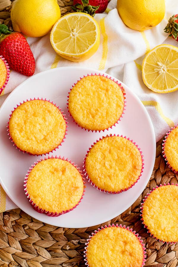 freshly baked lemon cupcakes in pink liners