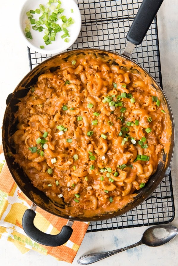 Homemade Hamburger Helper with cheesy tomato sauce in a large skillet