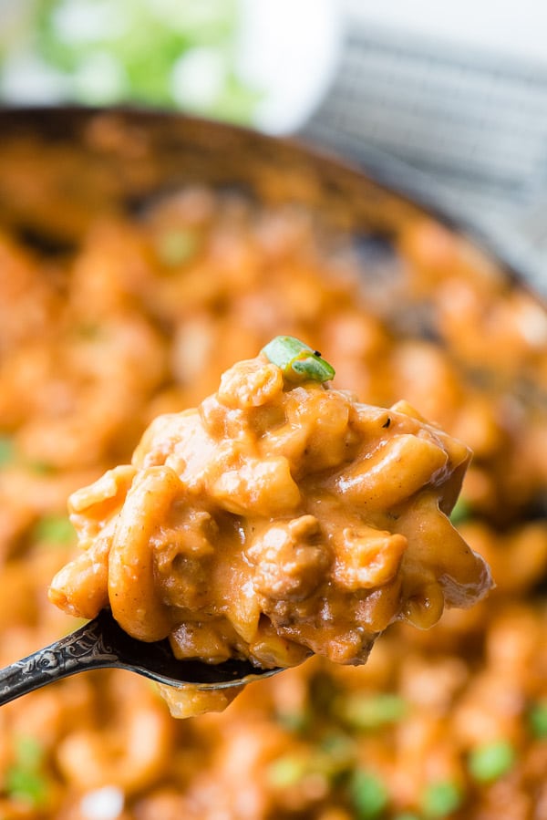 Forkful of cheesy homemade hamburger helper with pasta