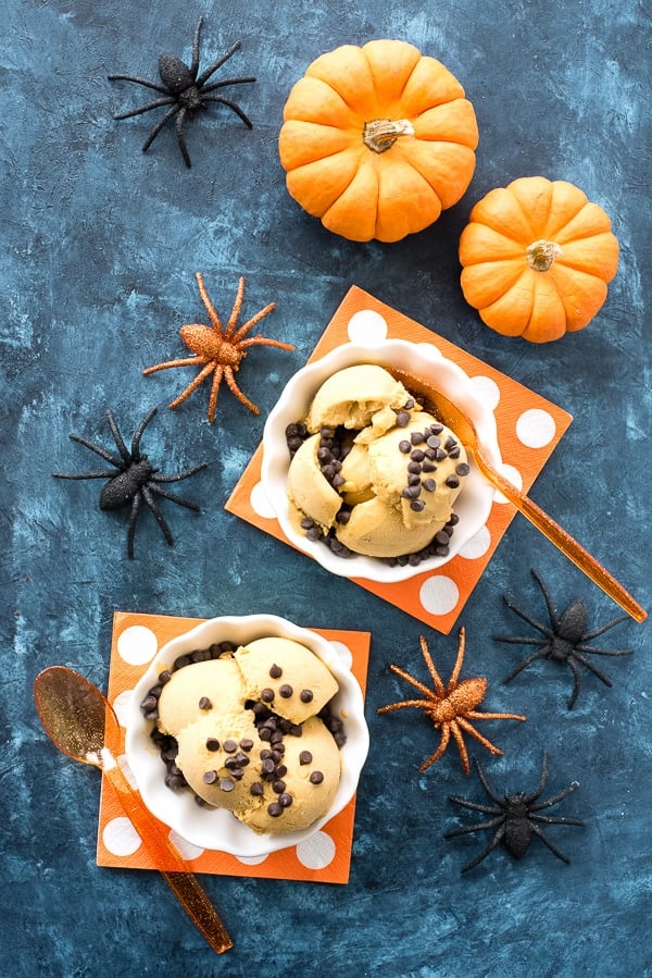 Vegan Pumpkin Spice Ice Cream with Mini Chocolate Chips with mini pumpkins and orange spiders