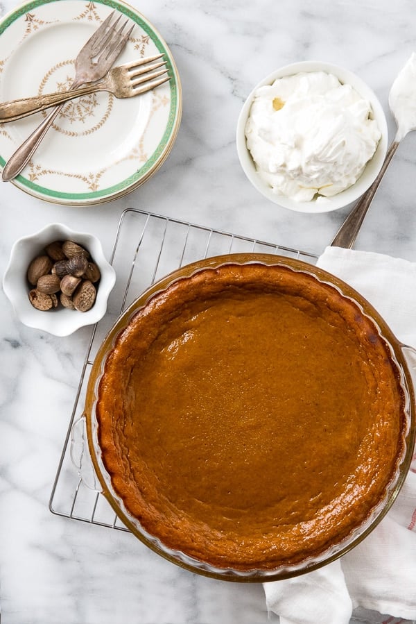 crustless pumpkin pie freshly baked with bowl of whipped cream