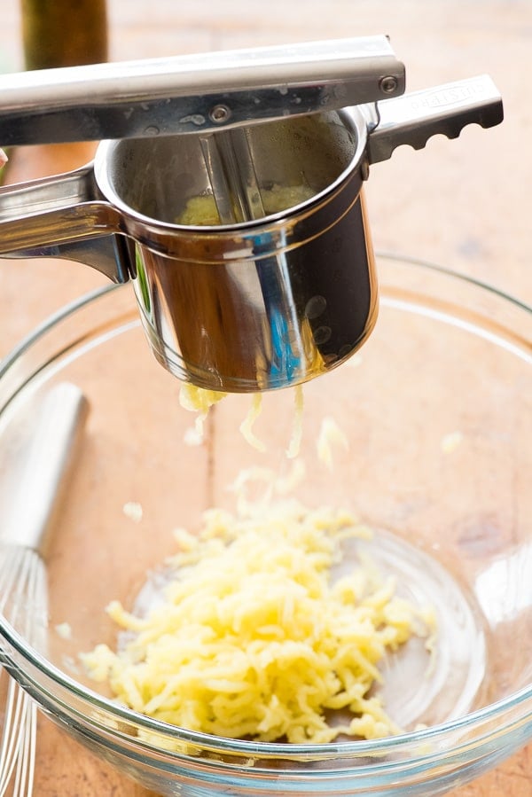 Potato Ricer and golden potatoes 