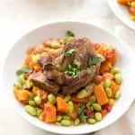 Instant Pot Short Ribs on bed of Harvest Succotash in white bowl