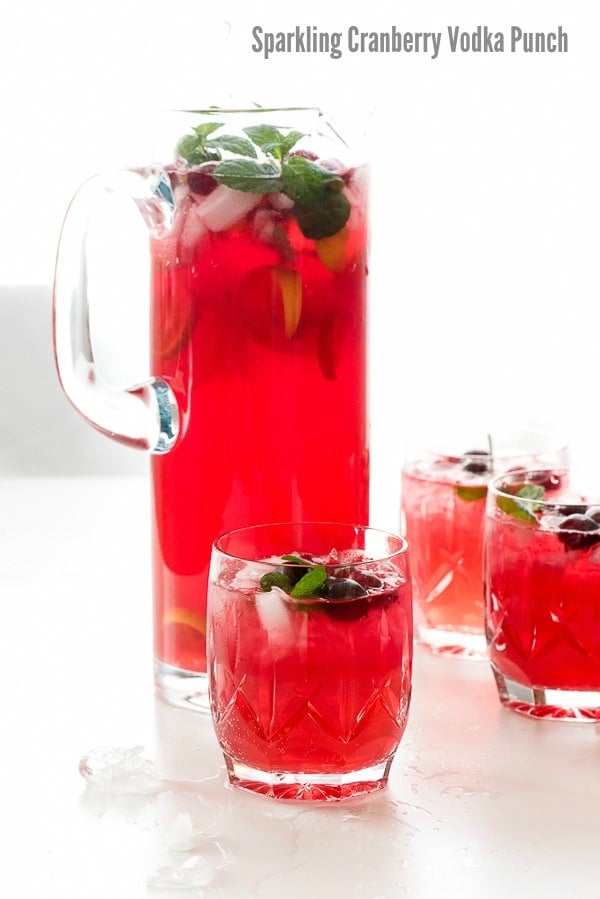 Sparkling Cranberry Vodka Punch in glass pitcher and glasses