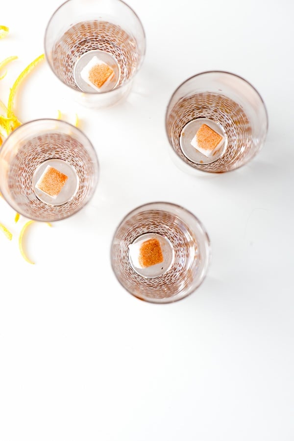 sugar cubes in a champagne glass doused with bitters