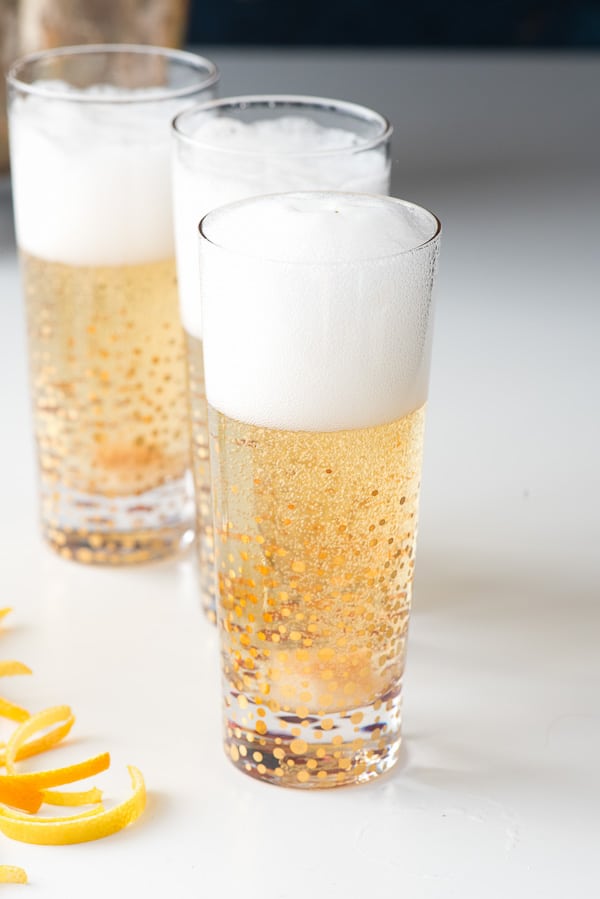 champagne poured in glass with sugar cube