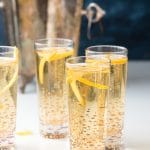 Assembled champagne cocktails with silver champagne bucket