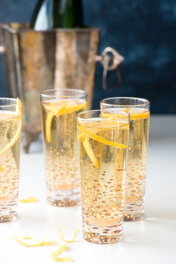 Assembled champagne cocktails with silver champagne bucket