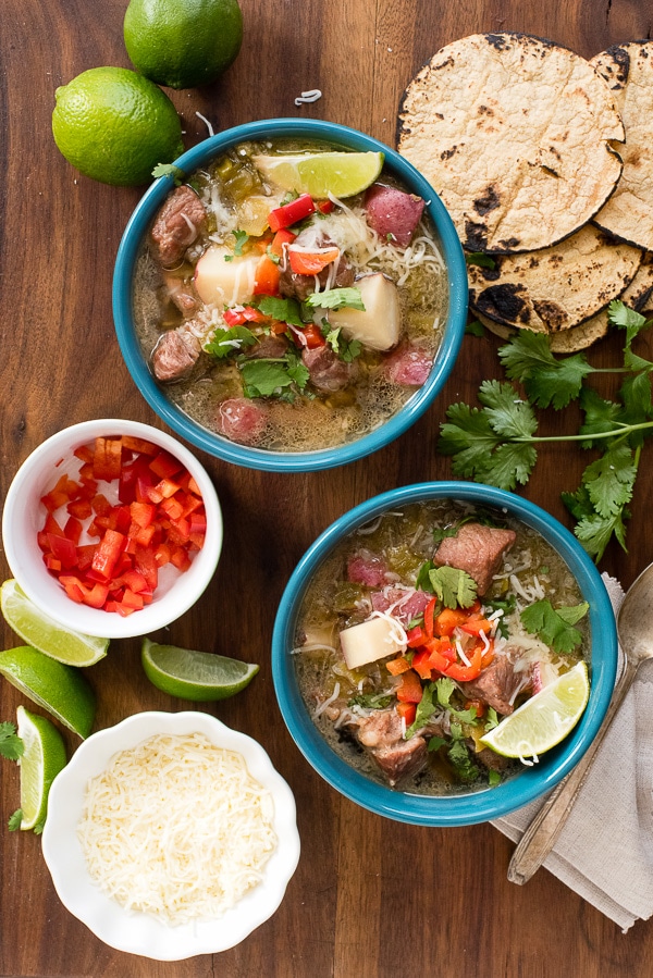 Green Chili Stew with corn tortillas and toppings