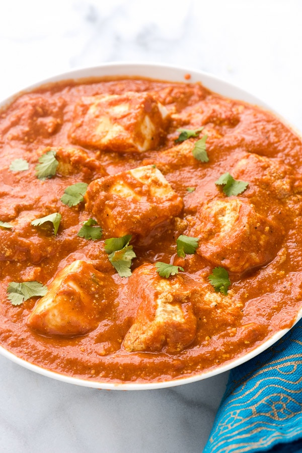 overhead image of a bowl filled with a homemade paneer tikka masala recipe