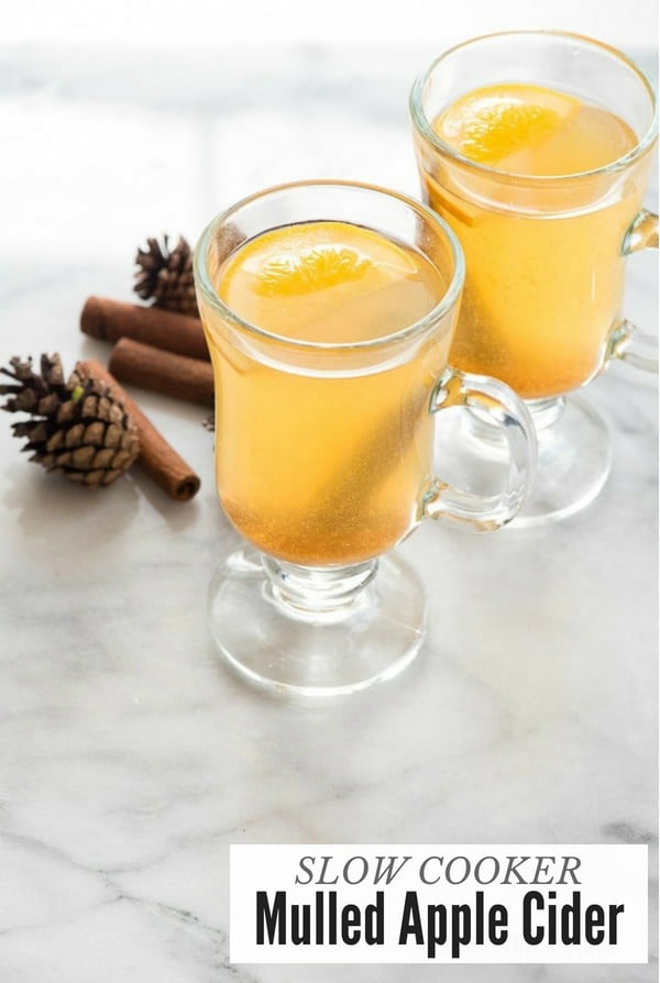 Mulled Apple Cider in glass mugs with cinnamon sticks