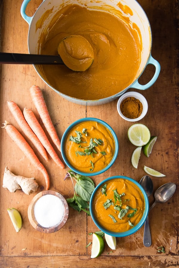 Curried Roasted Carrot Ginger Soup in bowls and pots