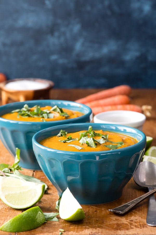 blue bowls of Curried Roasted Carrot Ginger Soup. 