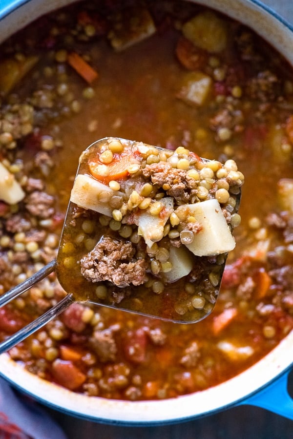 Mexican Chorizo Lentil Stew in a soup scoop