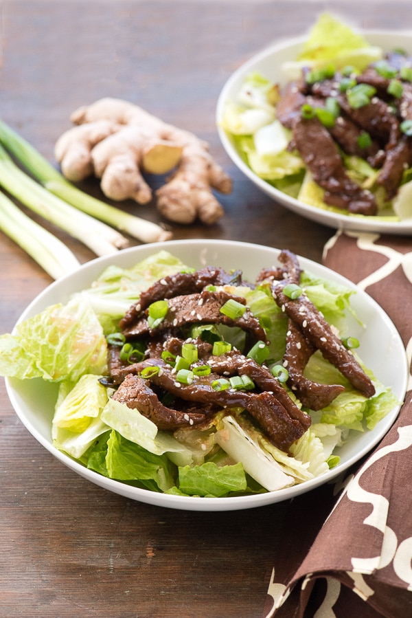 A plate of Mongolian Beef Salad with Ginger Vinaigrette.