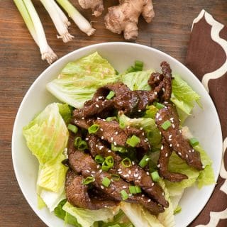 A plate of Mongolian Beef Salad with Ginger Vinaigrette.