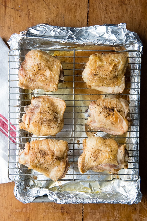 Salt and Pepper Roasted Chicken Thighs on wire rack