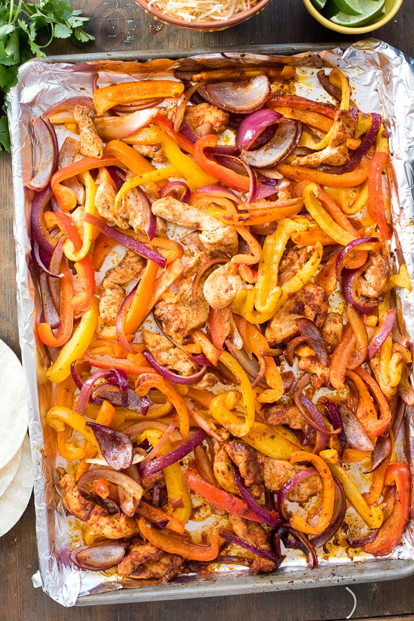 Sheet Pan of chicken fajitas with colorful peppers, onions and chicken