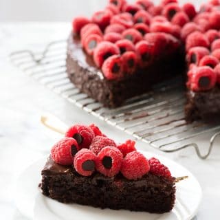 Slice of Triple Chocolate Wacky Cake with Chocolate-Stuffed Raspberries