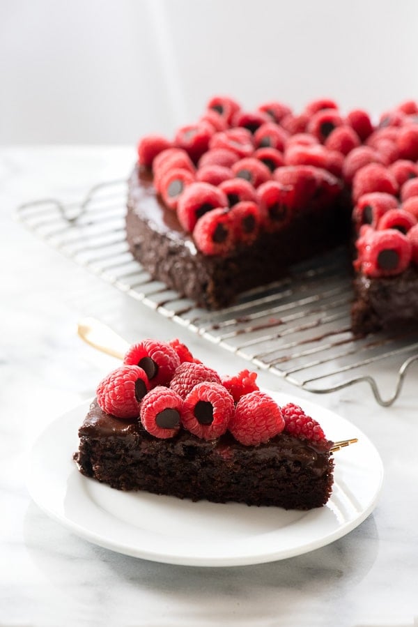 Slice of Triple Chocolate Wacky Cake with Chocolate-Stuffed Raspberries 