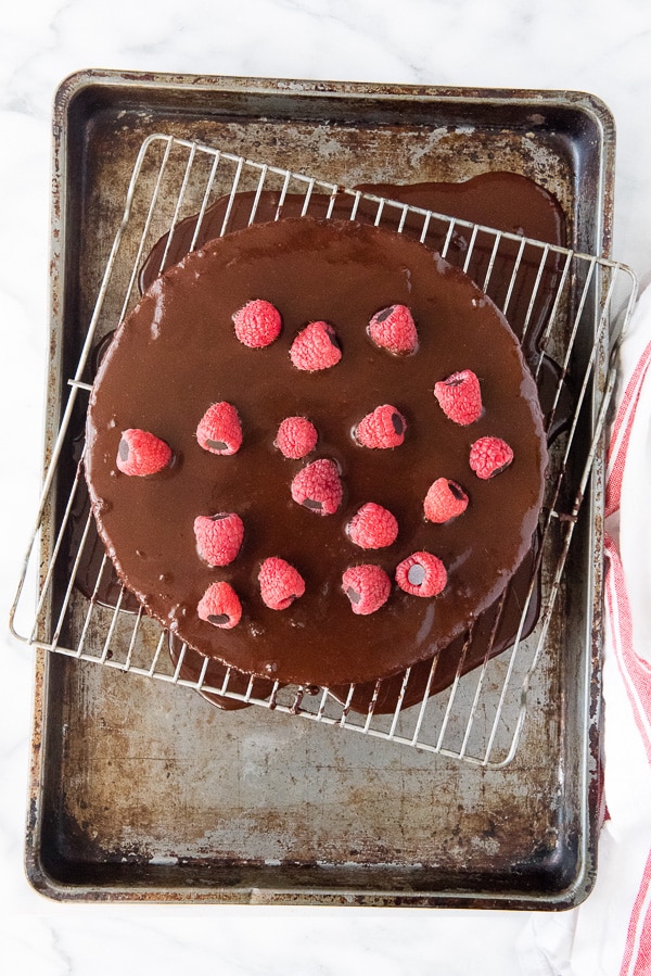 Wacky Cake with chocolate ganache on cooking rack