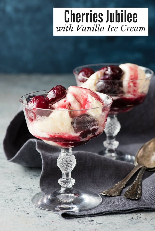 Cherries Jubilee in glass goblets with vanilla ice cream