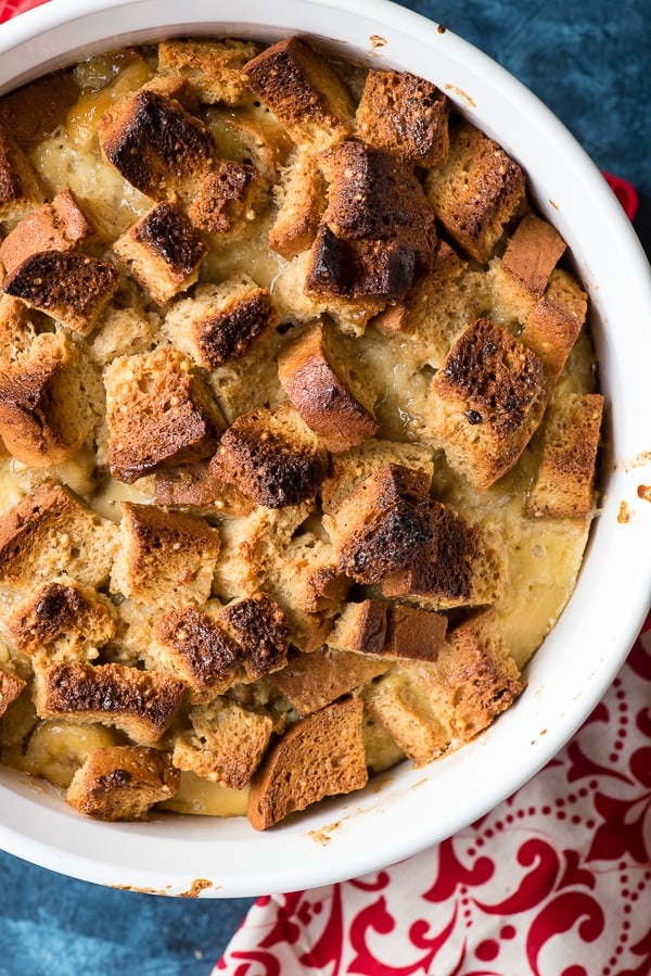 close up of Gluten-Free Bananas Foster Bread Pudding in white baking dish