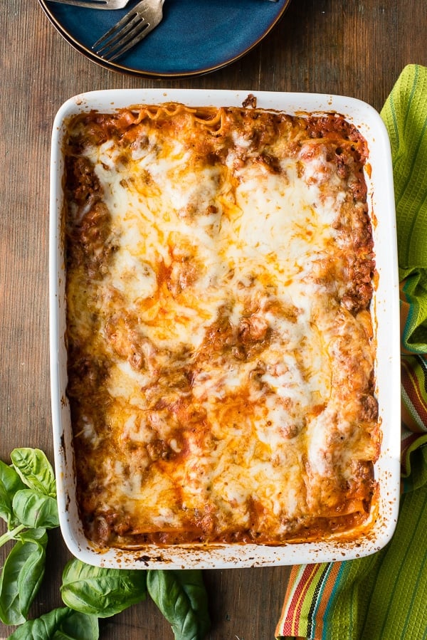 overhead view of cooked pan of meat lasagna with cheesy top