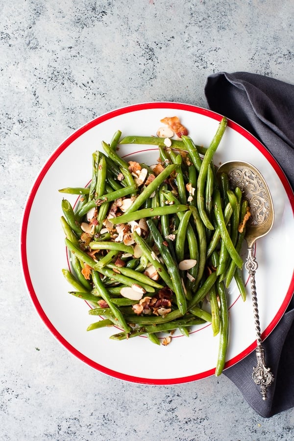 Fresh Green Beans with Bacon and Sliced Almonds with silver serving spoon