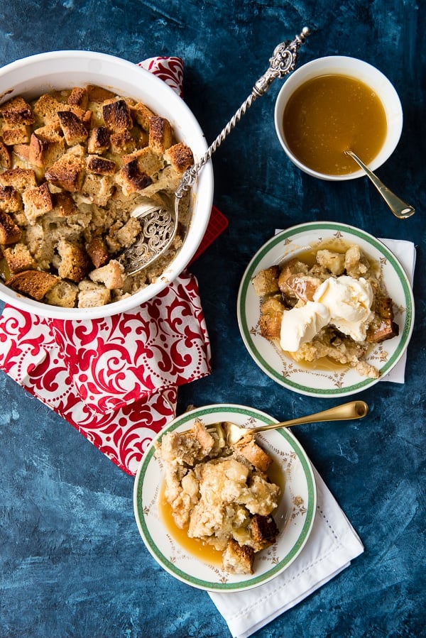 banana foster bread pudding in a baking dish and servings dished out onto plates