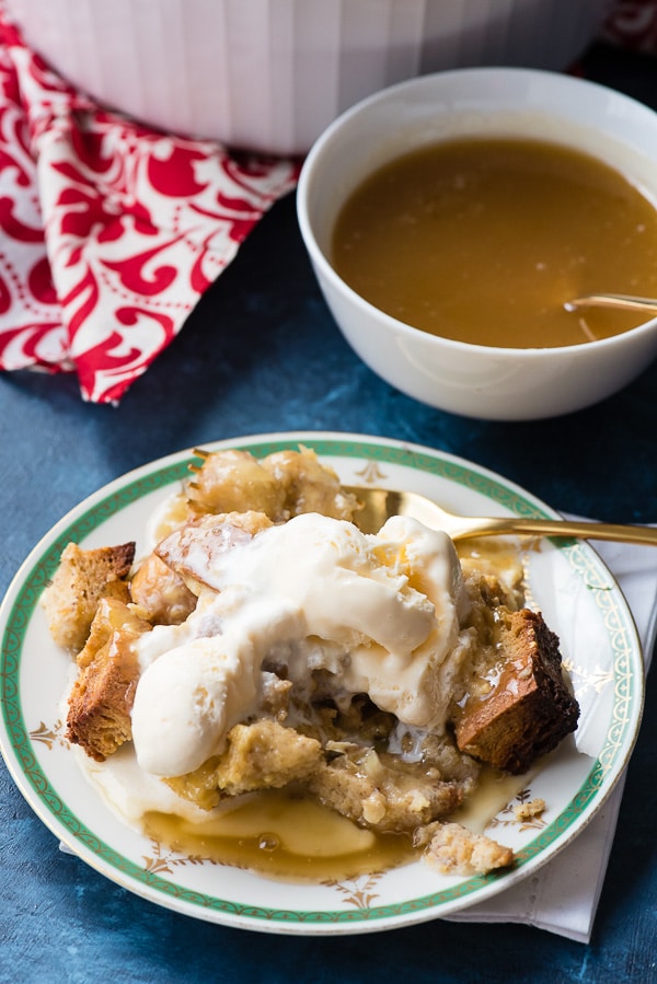 Gluten-Free Bananas Foster Bread Pudding serving on plate with ice cream on top