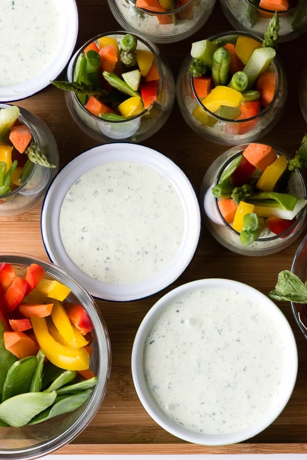 Green goddess dressing with colorful cut vegetables