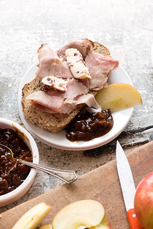 Ploughman's Lunch chutney meat and cheese slices on a white plate