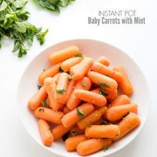 Instant Pot Baby Carrots with Mint in a white bowl