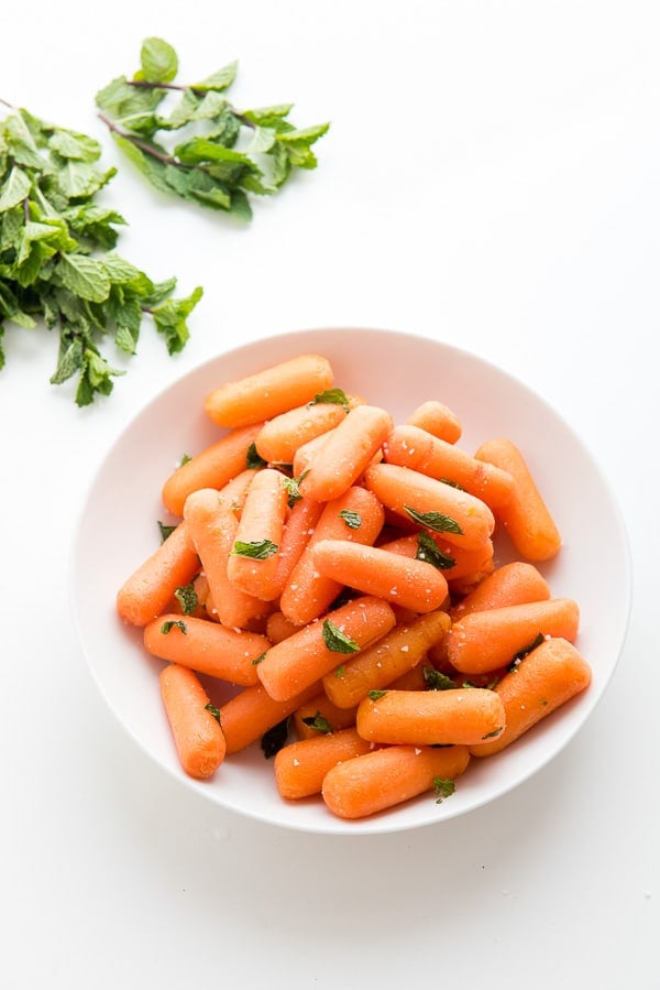 bowl of baby carrots with mint