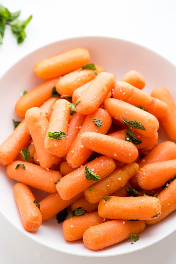 Instant Pot Baby Carrots with Mint in a white bowl