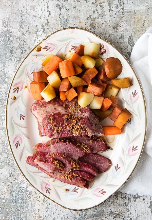 Instant Pot Corned Beef Brisket in Beer with vegetables on a vintage platter