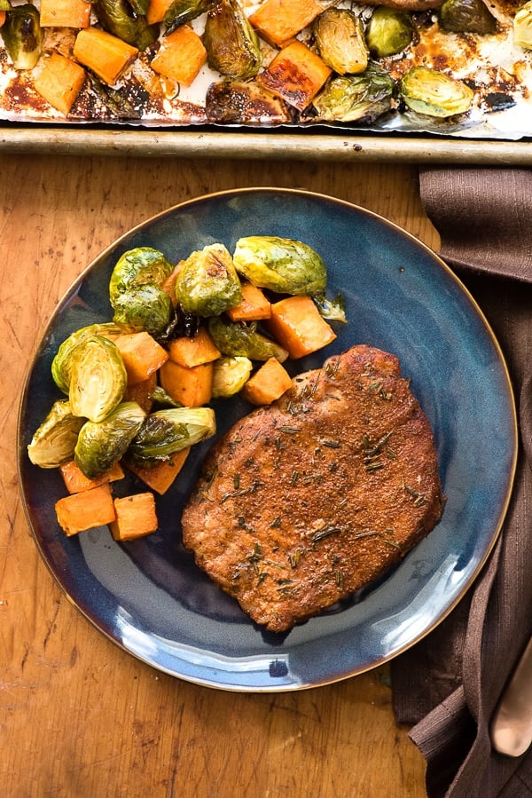 Spicy Pork Chops wtih Brussels Sprouts and Sweet Potatoes on blue plate 