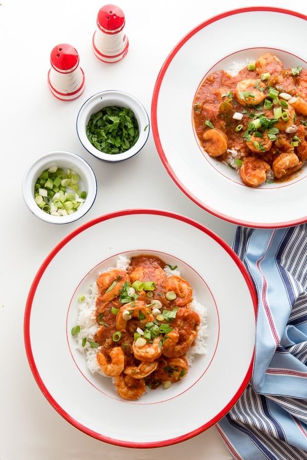 Spicy Shrimp Creole in white bowls with green onion garnish