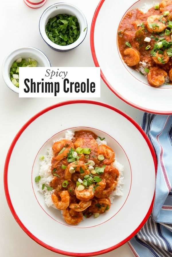 Shrimp Creole over rice in a large white bowl