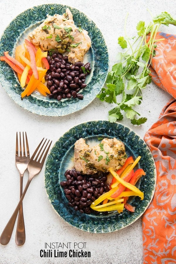 Juicy, fast-to-cook Chili Lime Chicken with sides dishes on green plates 