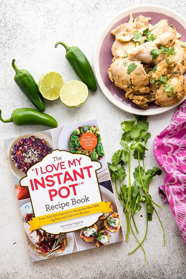 Instant Pot Chili Lime Chicken on a lavender plate with cookbook