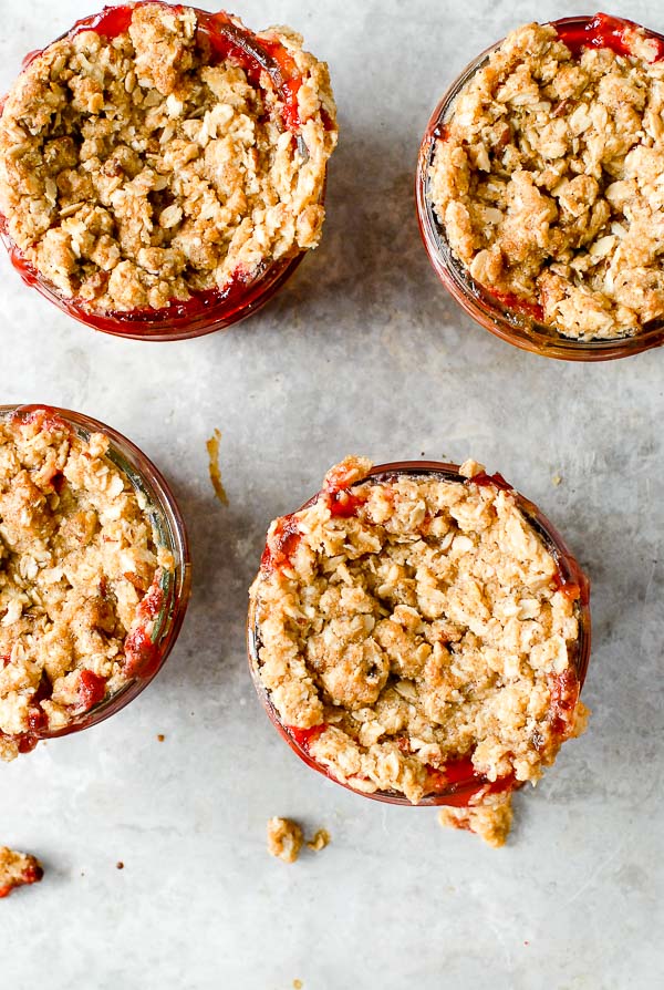 Rolled oat streusel topped strawberry peach Fruit Crumble Jars on galvanized metal tray 