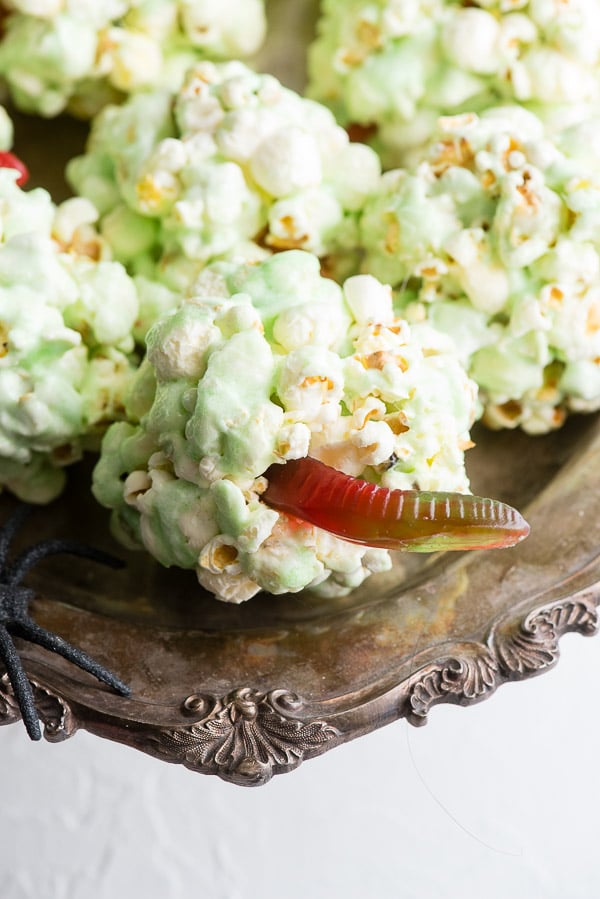 green Halloween Popcorn Ball recipe with gummy worms