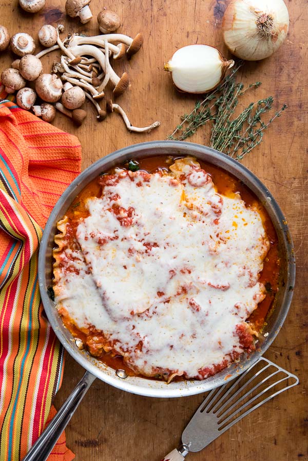 Cheesy Spicy Sausage Skillet Lasagna with fresh cremini mushrooms, yellow onion and fresh thyme sprigs w