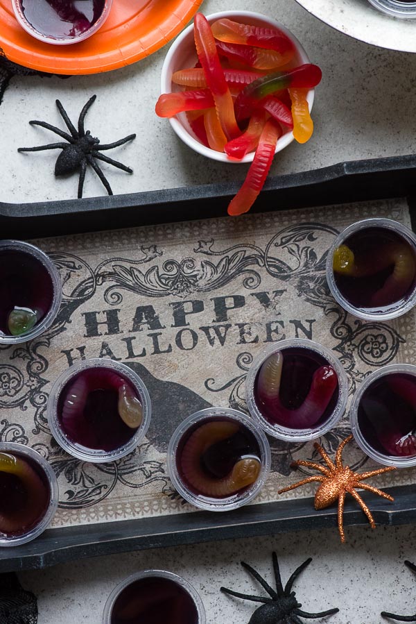 Halloween tray of grape Squirm Jello Shots with gummy worms inside 