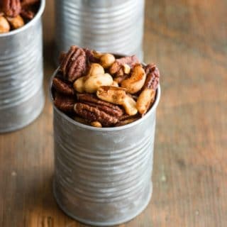 Sweet and spicy candied cashews and pecans in Sweet Spiced Nuts, in galvanized cans